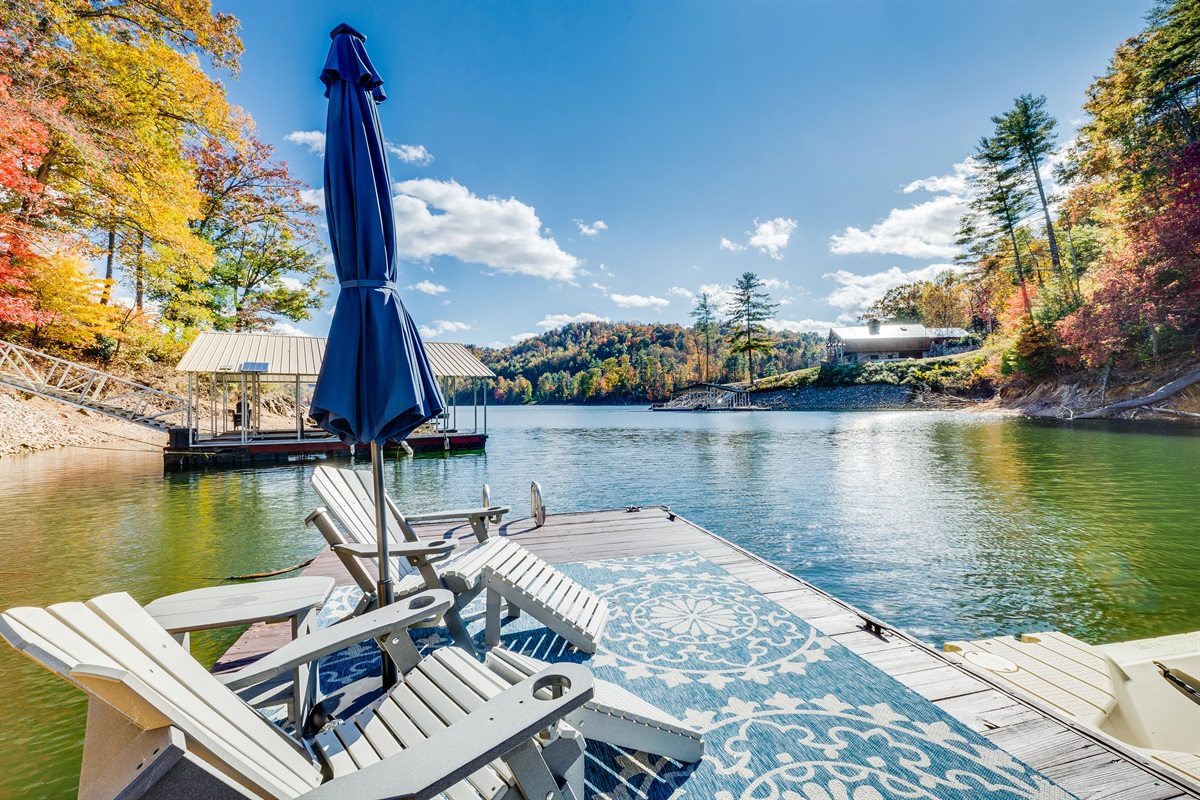 Lake view from swim platform with lounge chairs and umbrella