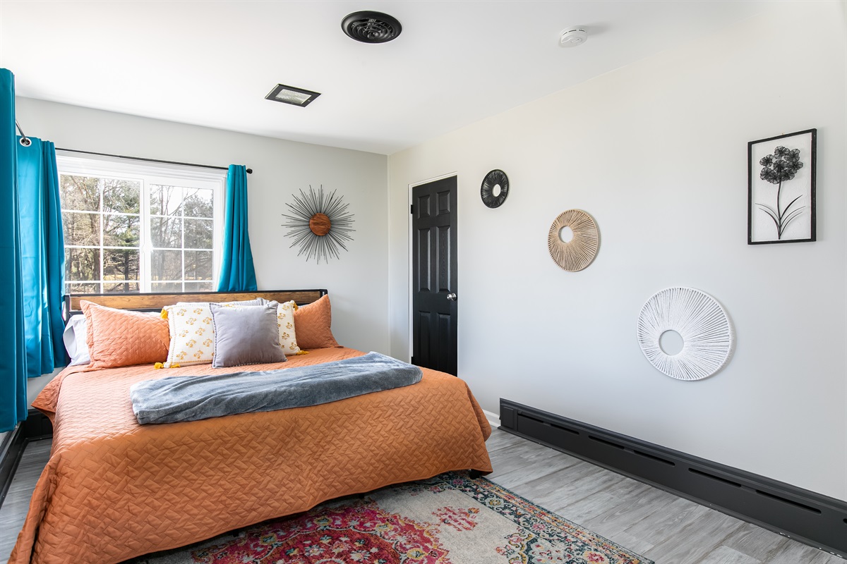 Another bright king bedroom with room darkening shades