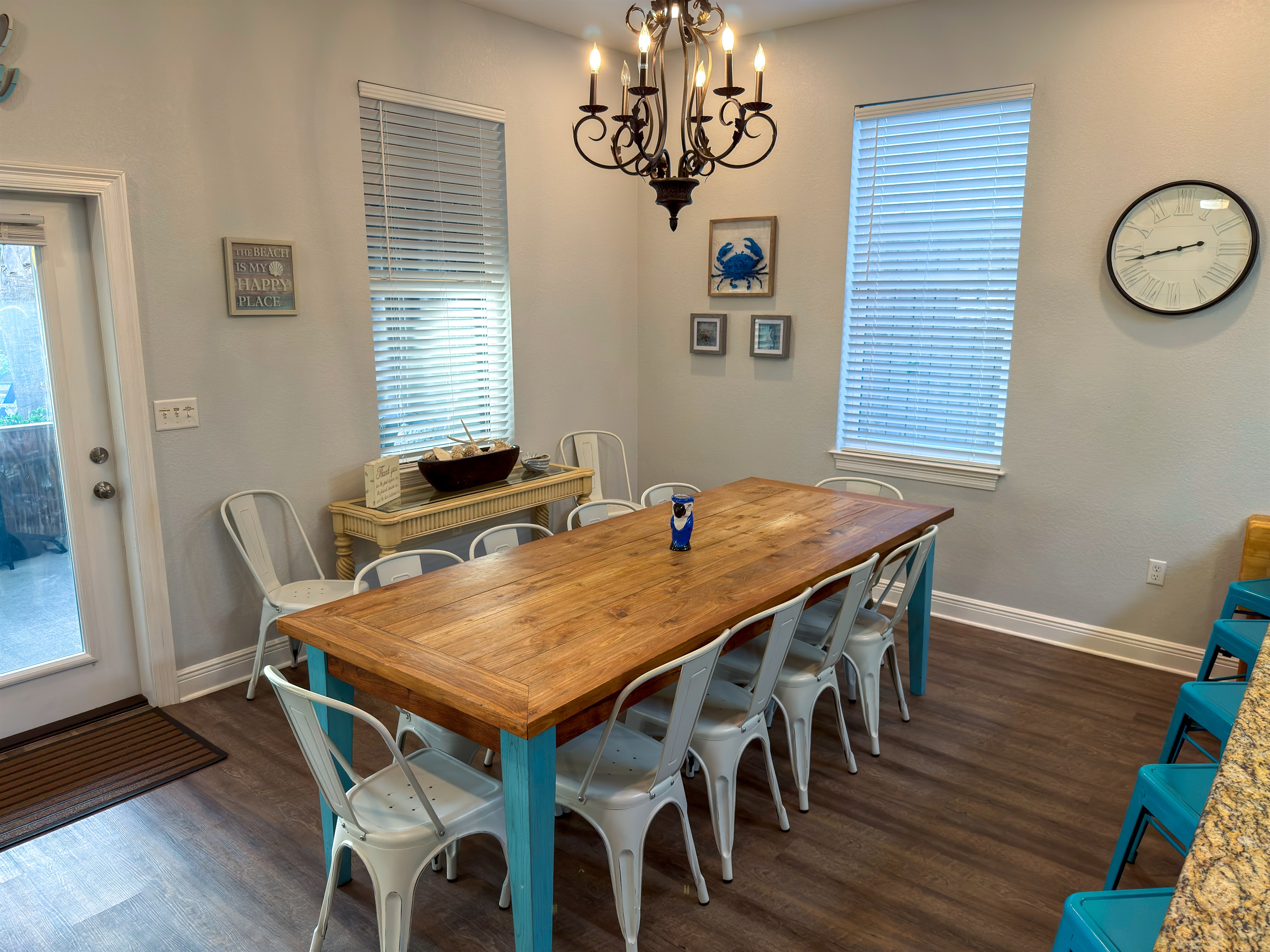 Coastal décor and warm chandelier lighting create a leisurely setting that feels welcoming from the moment you arrive.