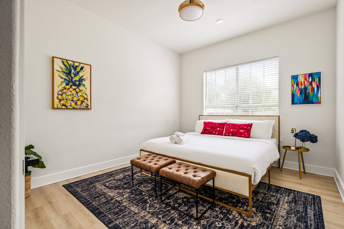 King-sized bed with full bathroom right outside door 