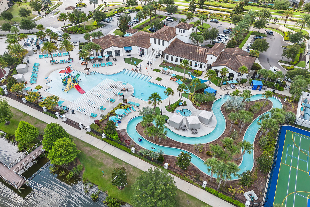 Overview of the community amenities: lazy river, pool, kids splash zone, clubhouse, fitness center, and on-site restaurant, Tu Casa.