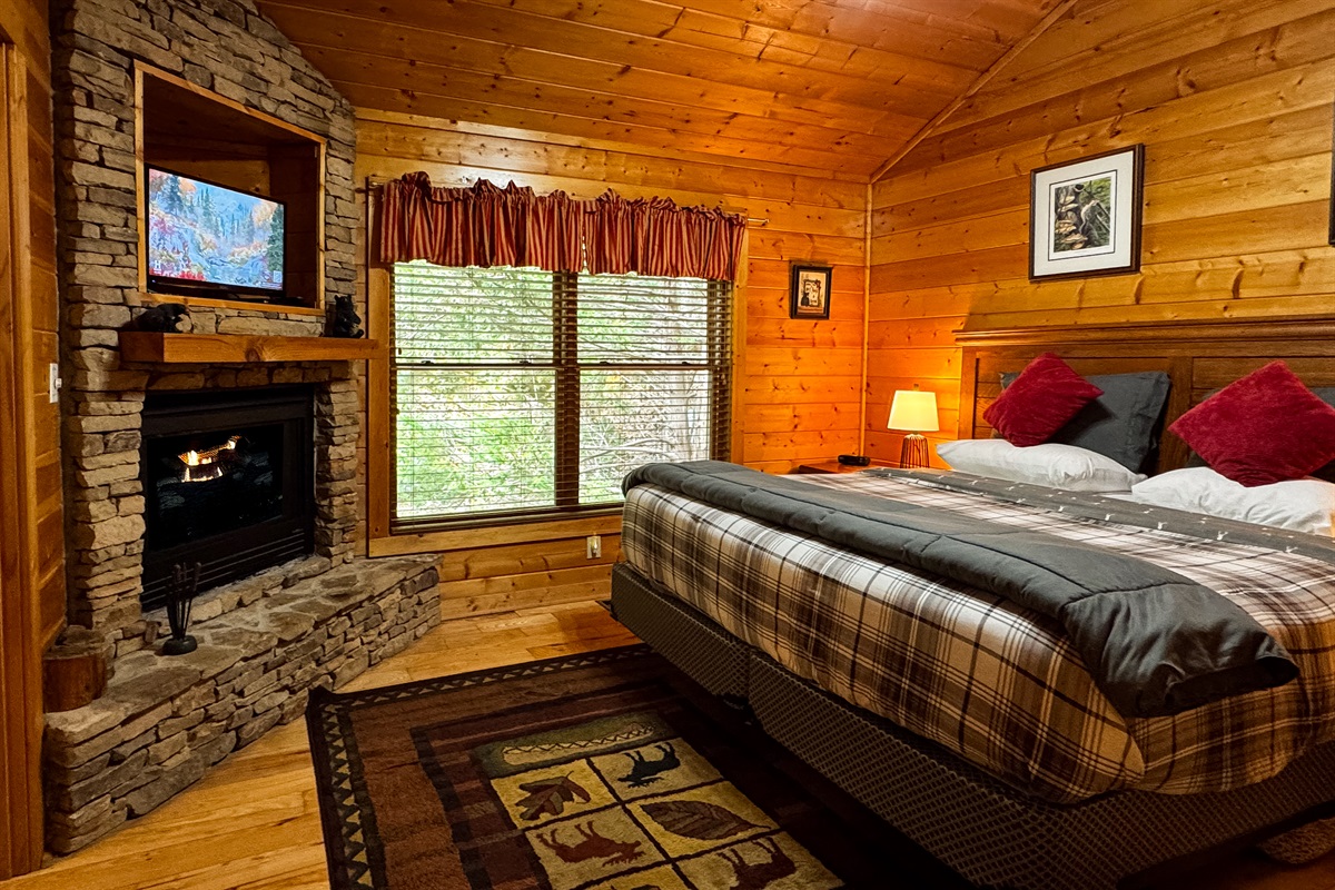 Relax at night with the cozy, romantic ambience of the gas fireplace in the Master bedroom with a king-size bed! The satellite TV has hundreds of options for entertainment.