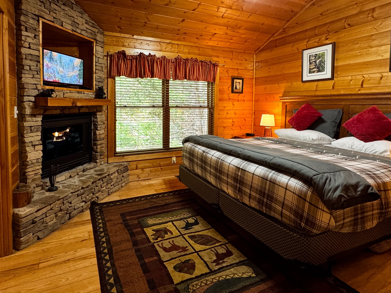 Relax at night with the cozy, romantic ambience of the gas fireplace in the Master bedroom with a king-size bed! The satellite TV has hundreds of options for entertainment.