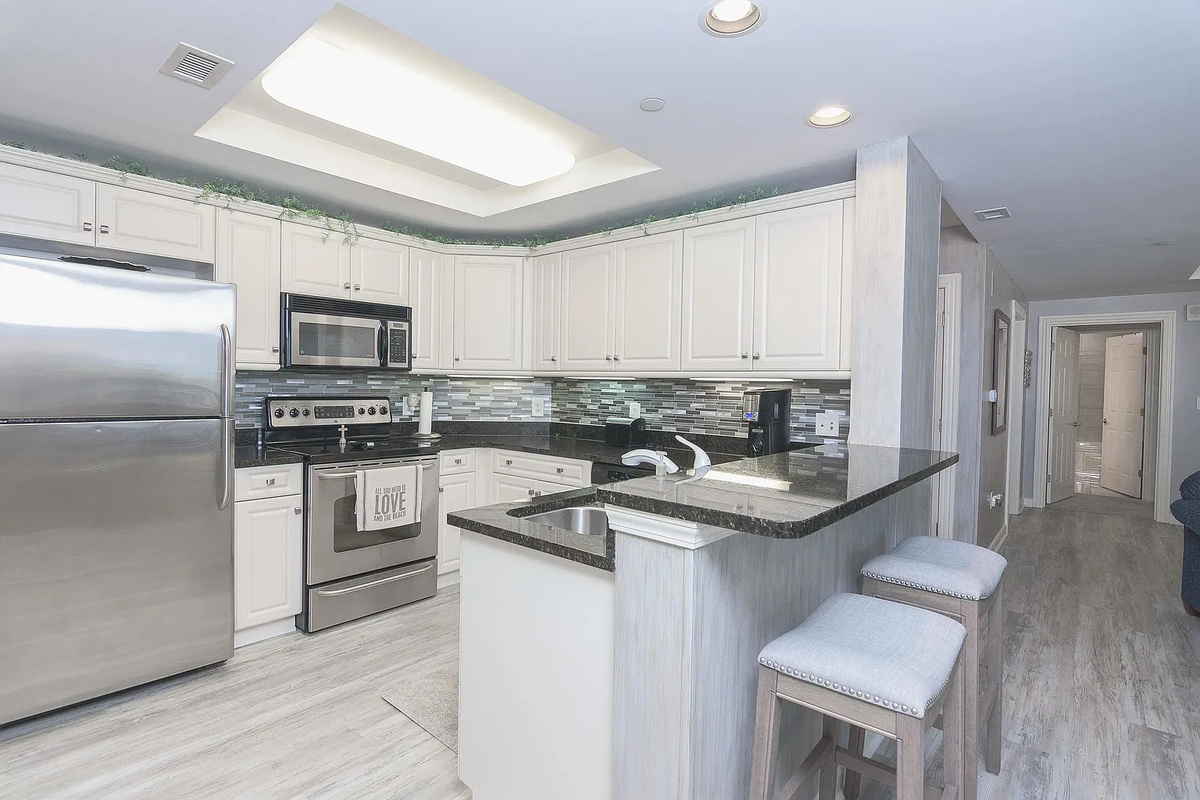 Breakfast bar off the kitchen with more seating