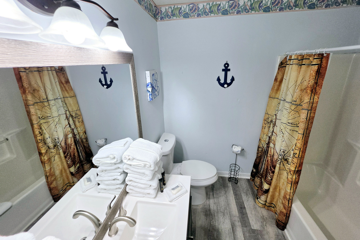 Bathroom vanity stocked with fresh towels