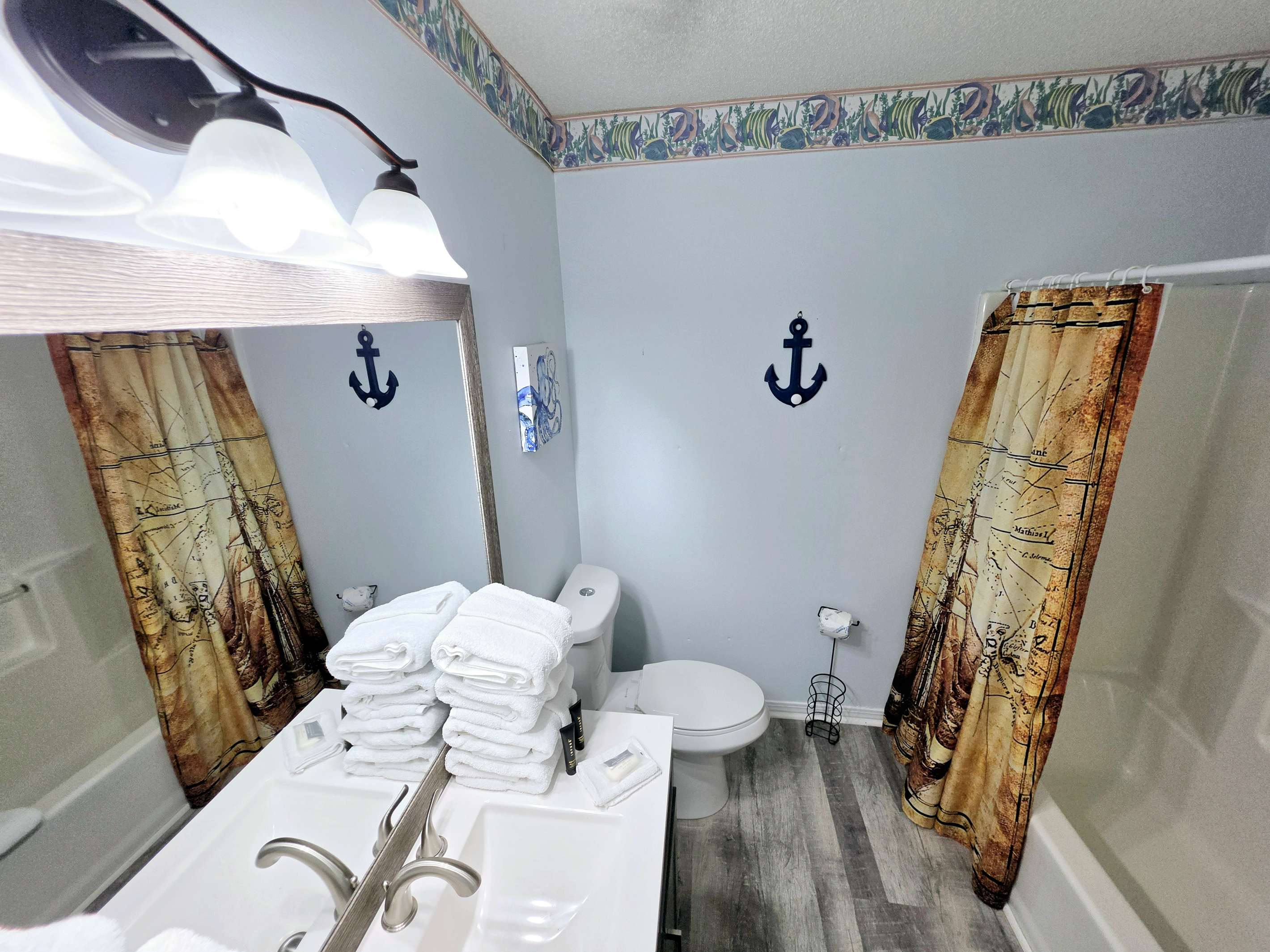 Bathroom vanity stocked with fresh towels