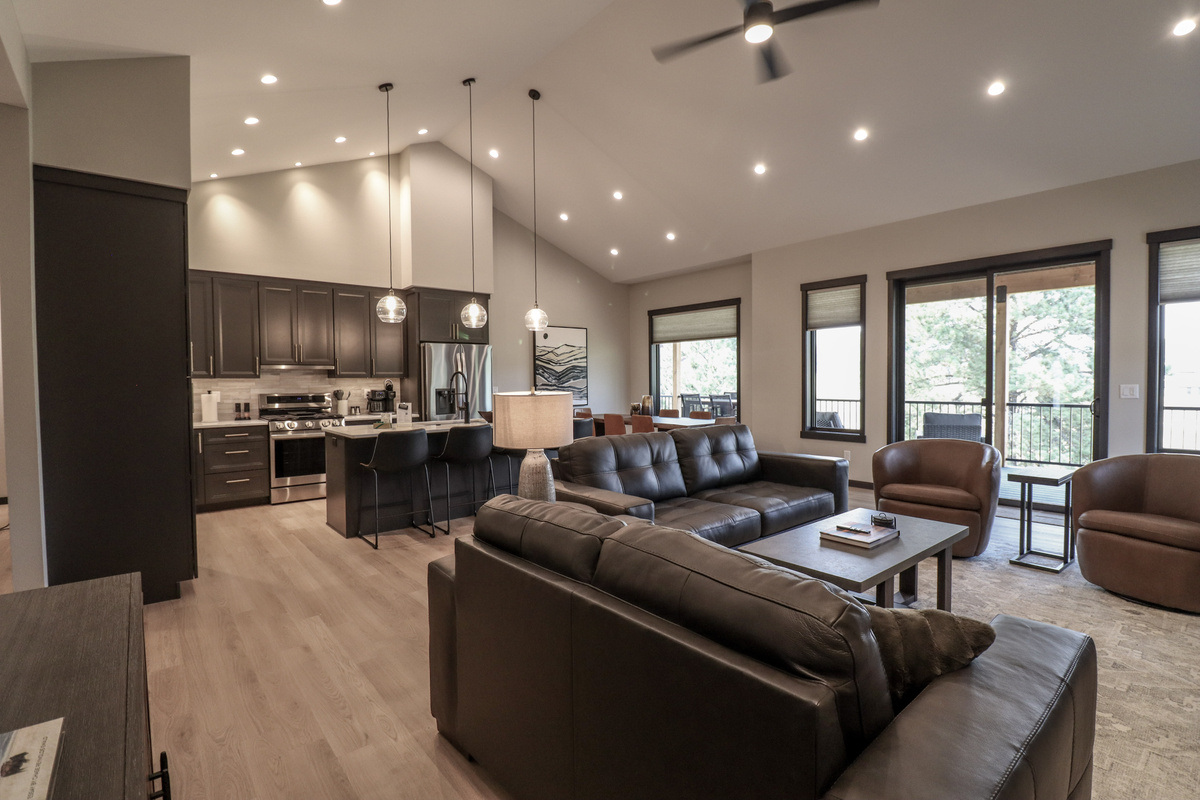 Open concept living room with kitchen and dining area.