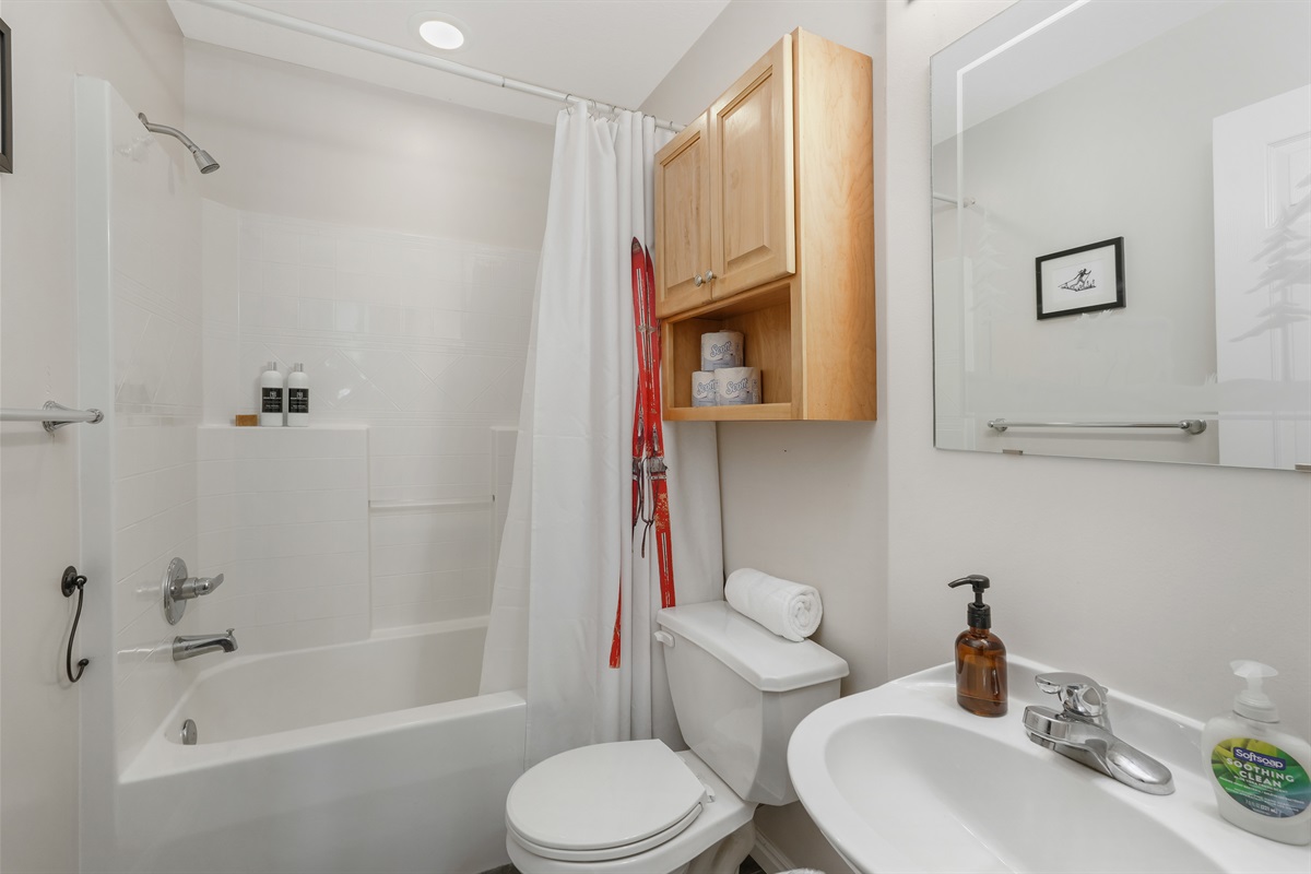 Main floor full bathroom with a clean, simple layout for everyday comfort.