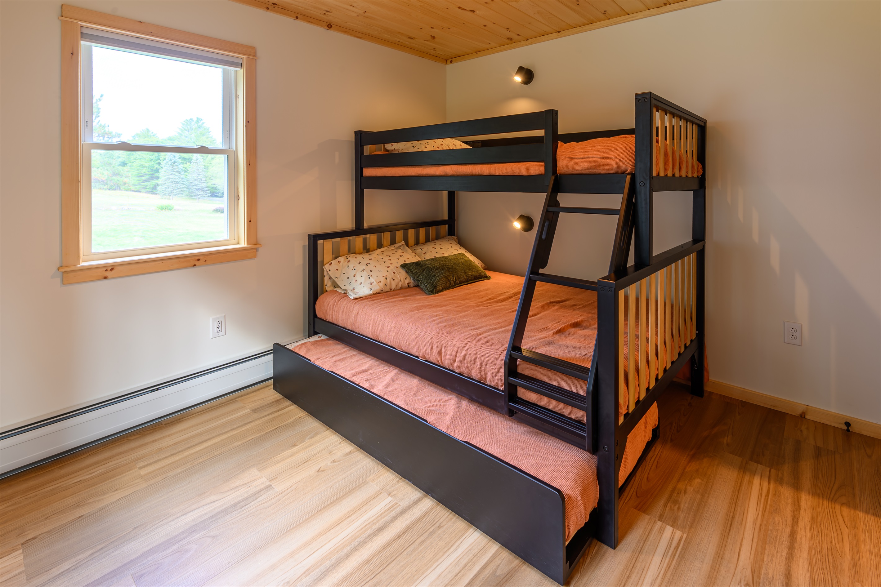 The bunk room features a Max & Lily twin over full bunk bed with a pull out twin trundle. Each bed has a reading light that can be turned on/off in bed for convenience.