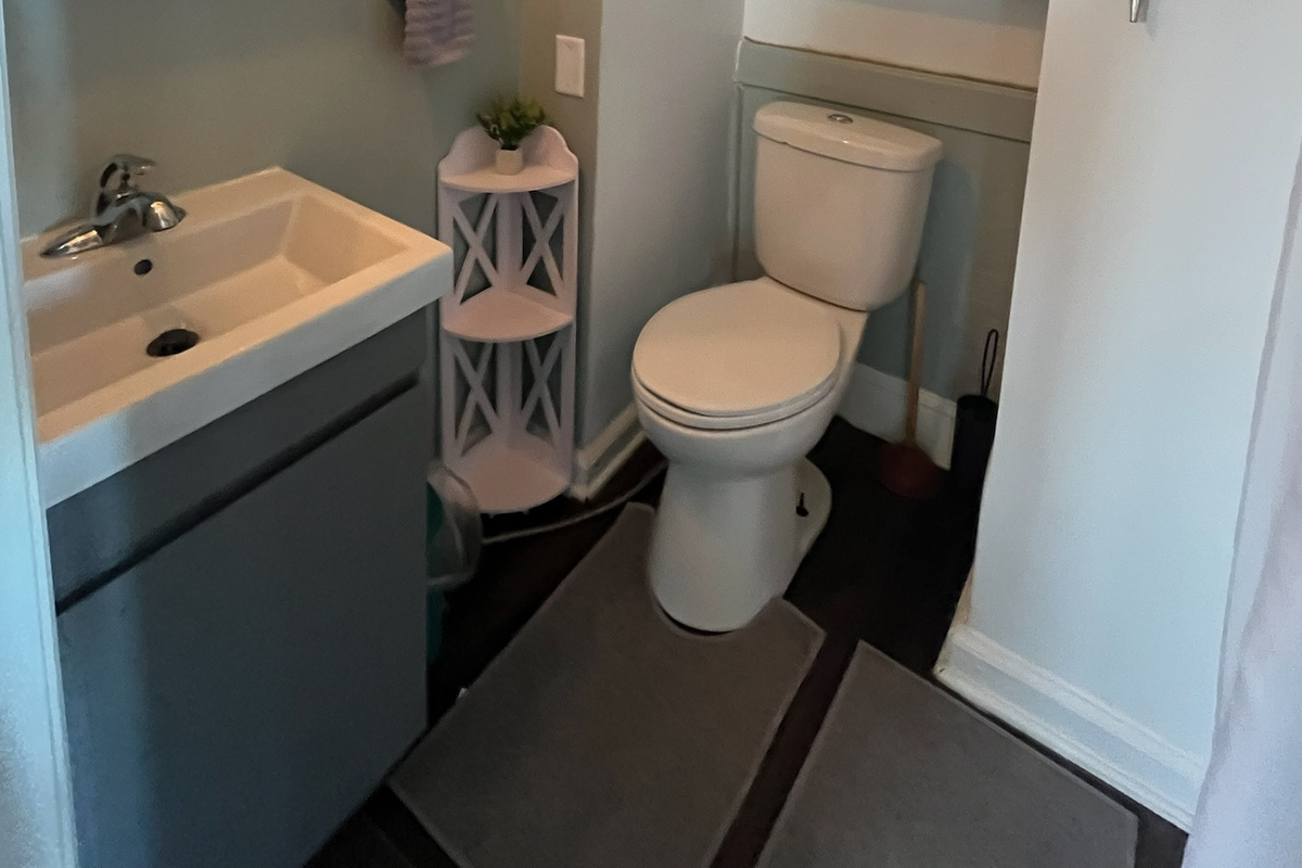 The downstairs full bathroom is just off the dining area.