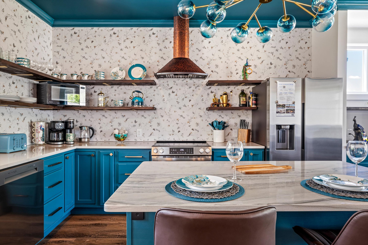 The large island is perfect for cooking together, sharing meals, or planning the day's adventures.