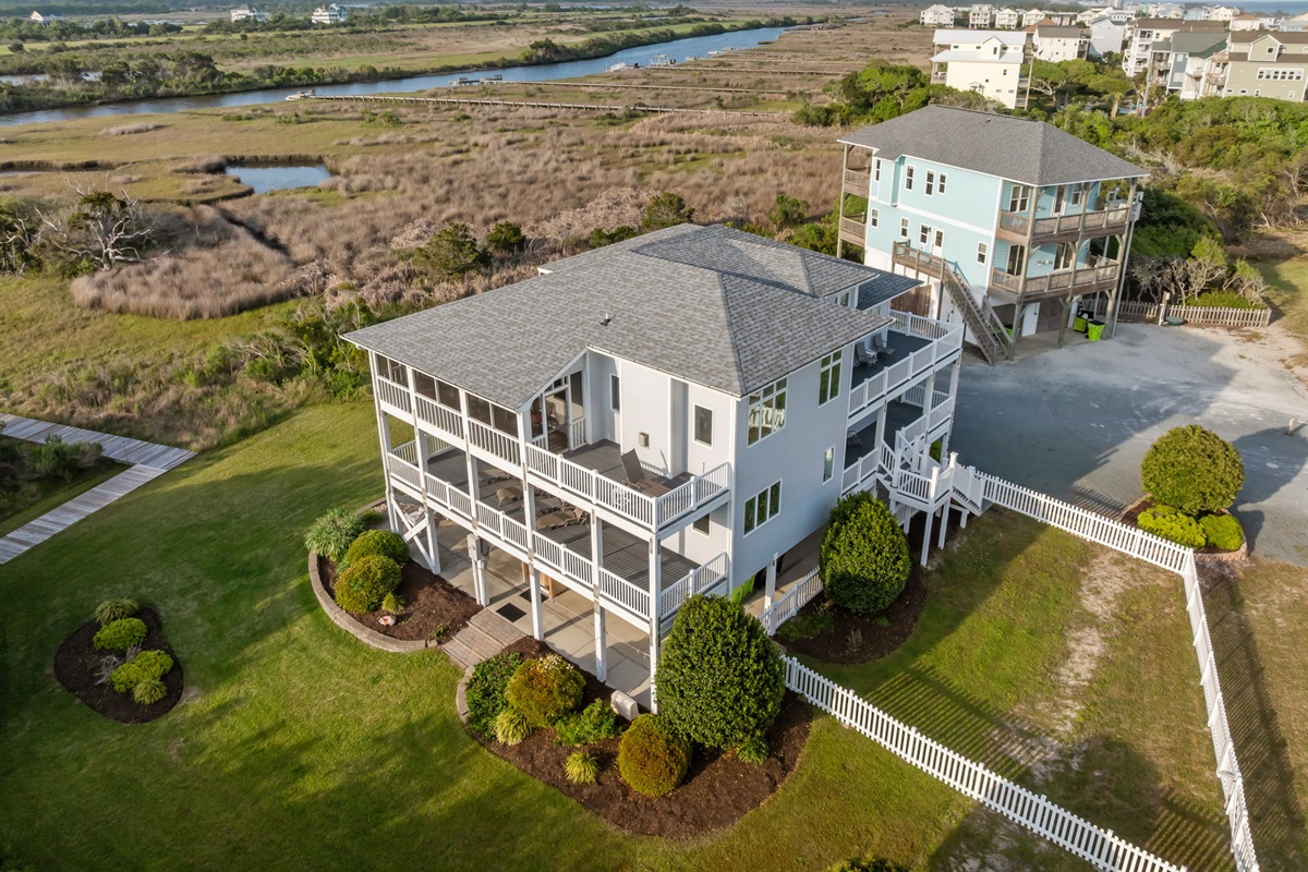 An expansive property with wraparound decks, large yard, and peaceful surroundings
