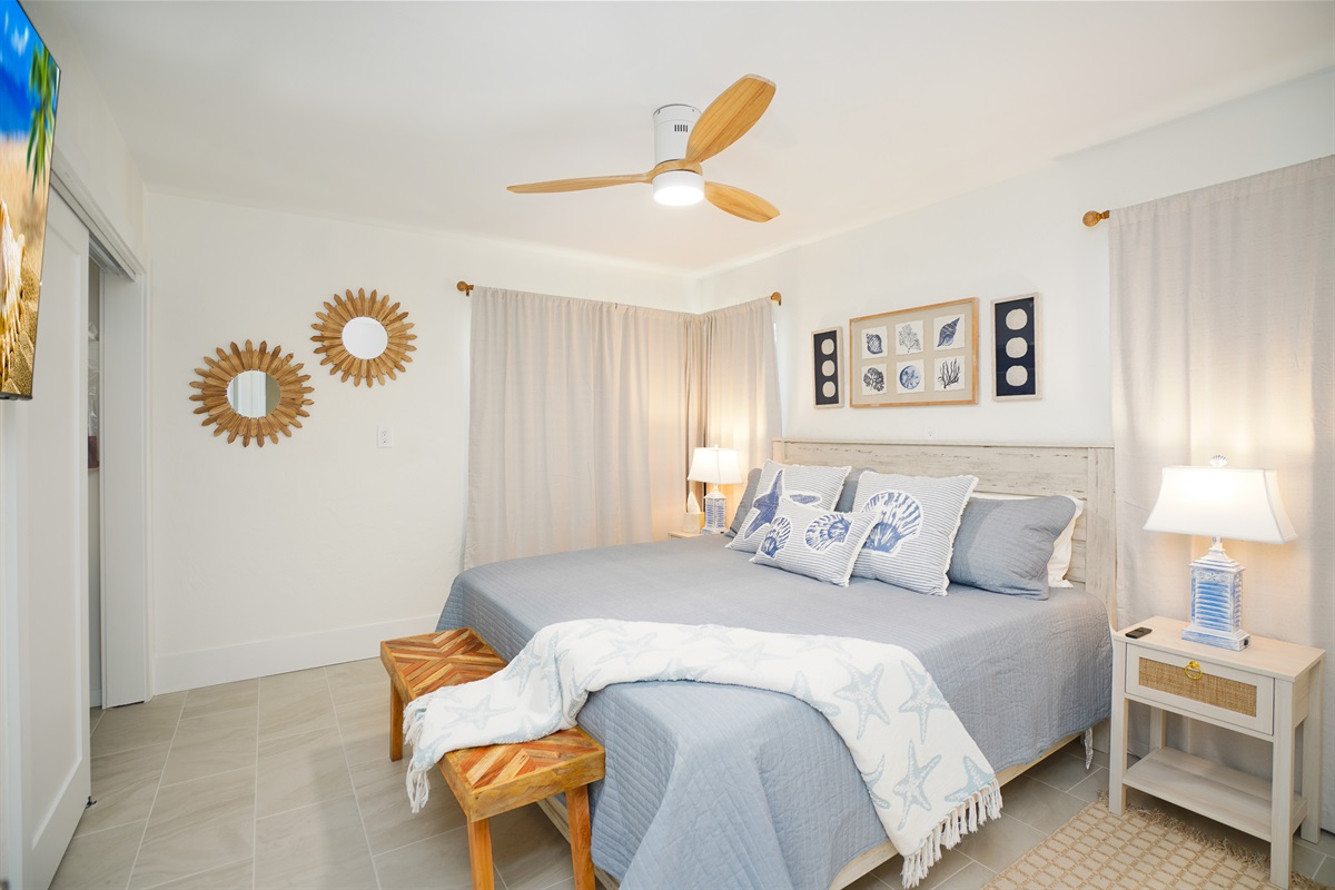 Bedroom 3 offers a king bed and smart TV.