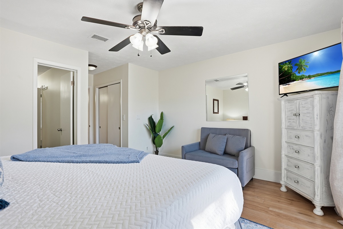 Bedroom # 2 is Downstairs with King Bed and Access to Backyard