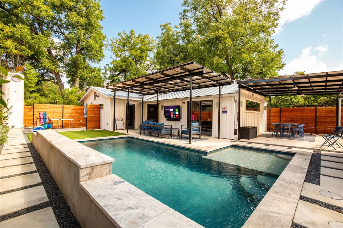 Soft lighting reflects off the water creating a peaceful backdrop for night swims or stargazing.