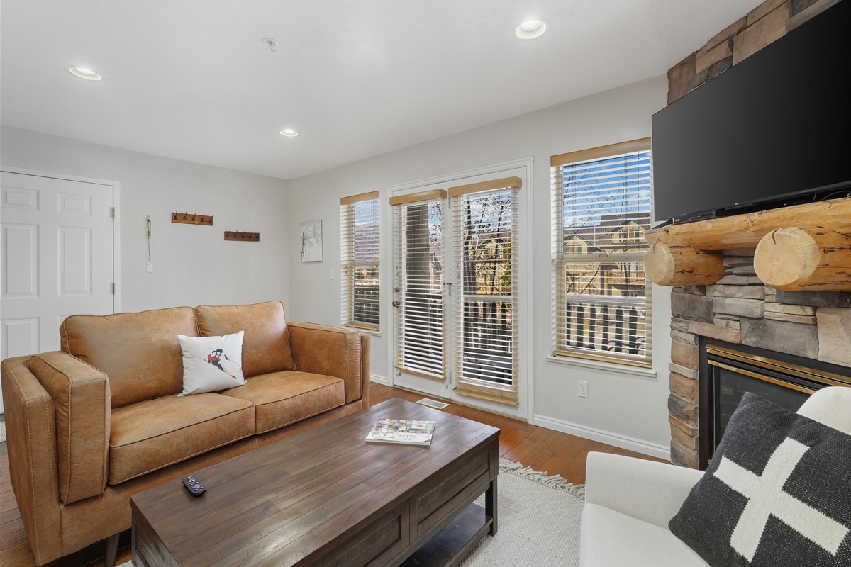 Comfortable seating and large windows make this the perfect spot to unwind, watch a movie, or gather together.