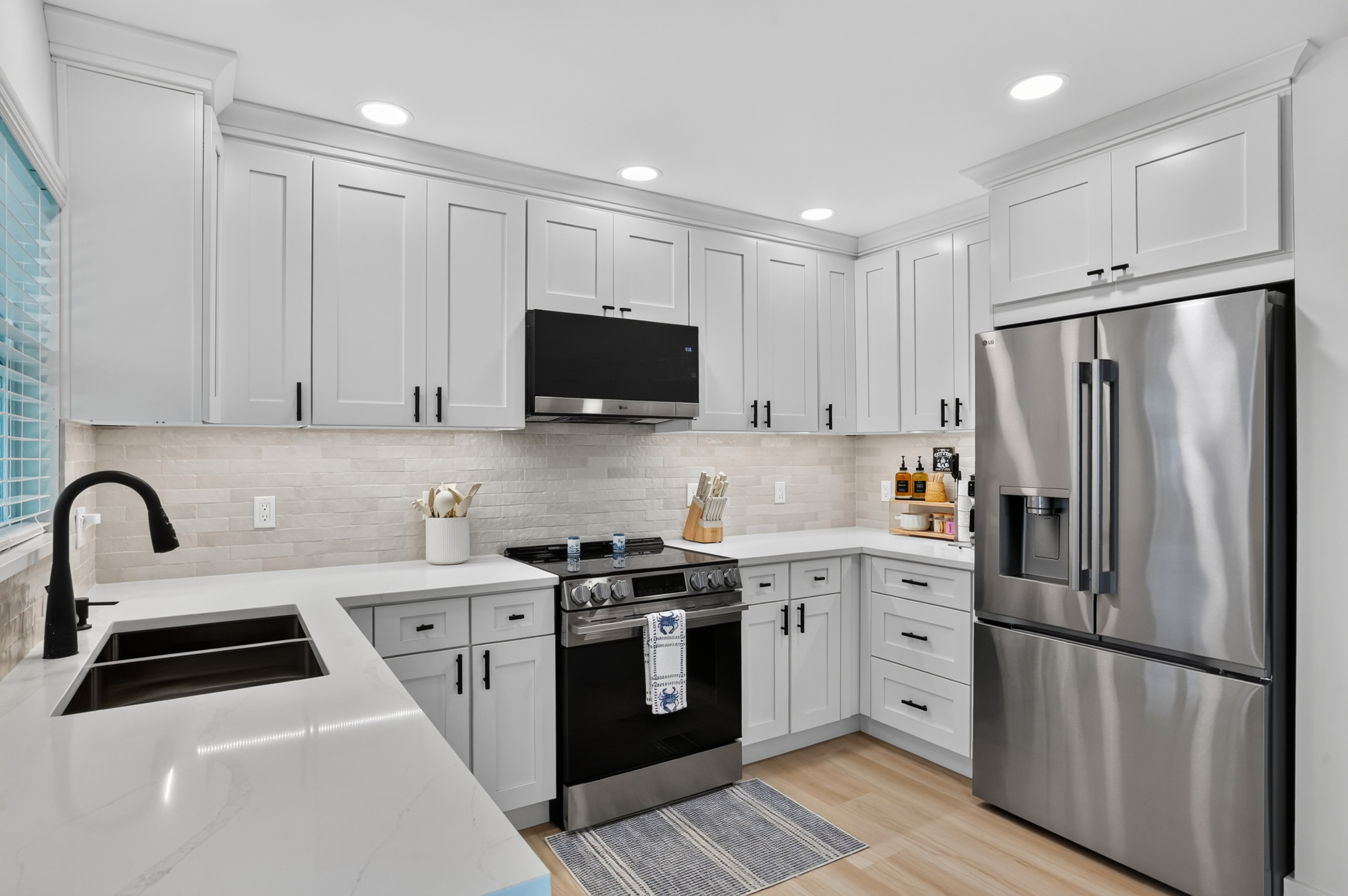 Bright cabinetry, stainless-steel appliances and generous counter space make this kitchen a pleasure to use.

