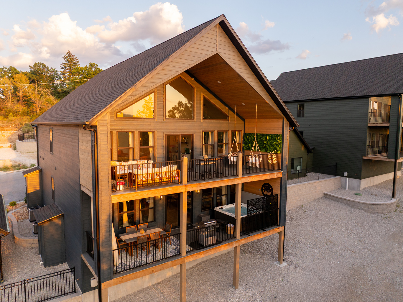 A first look at Enchanted Landing—a brand-new hillside retreat featuring soaring windows, two spacious decks, outdoor living and dining areas, and a private covered hot tub.