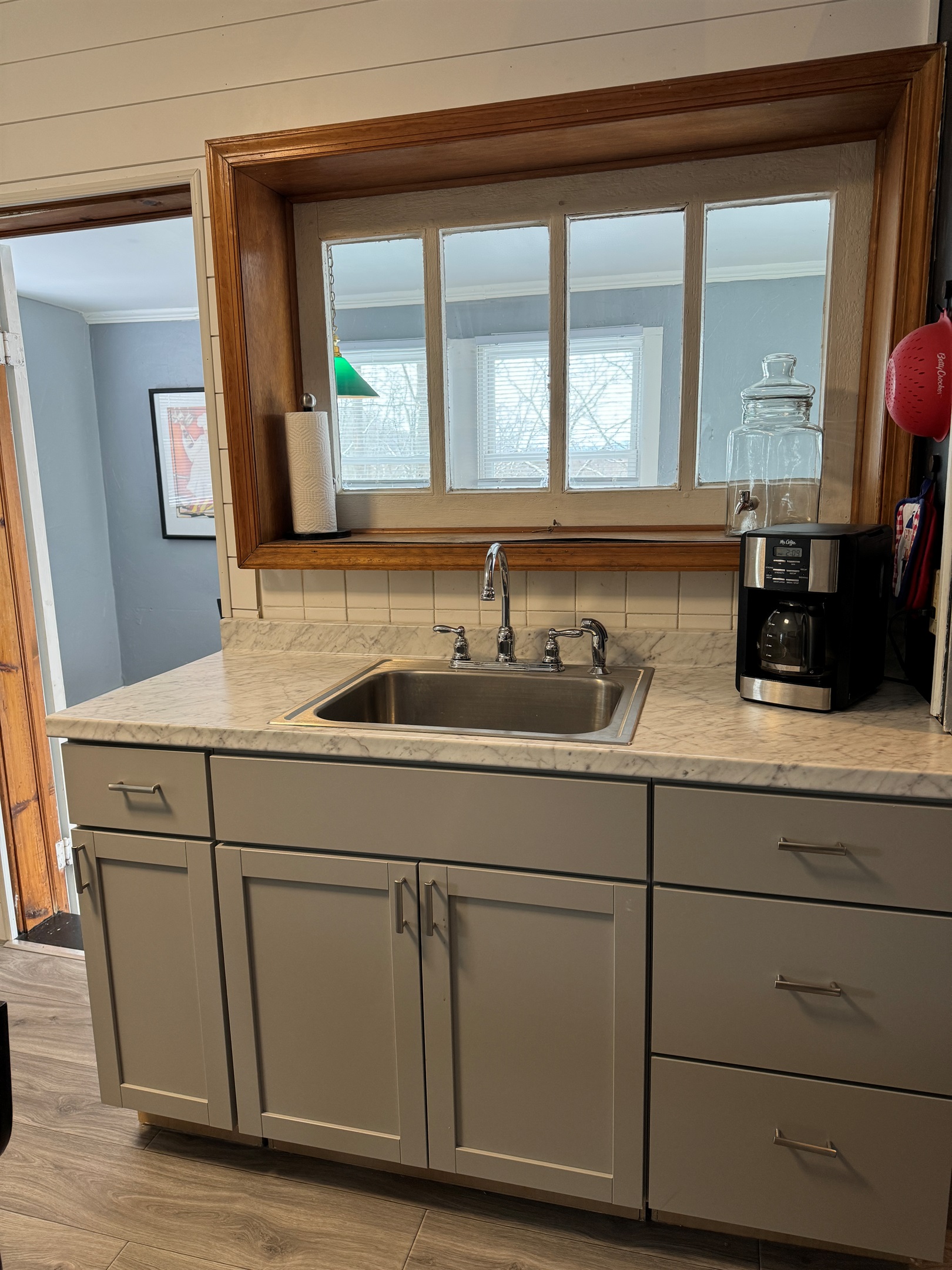 Sink area with dining room beyond