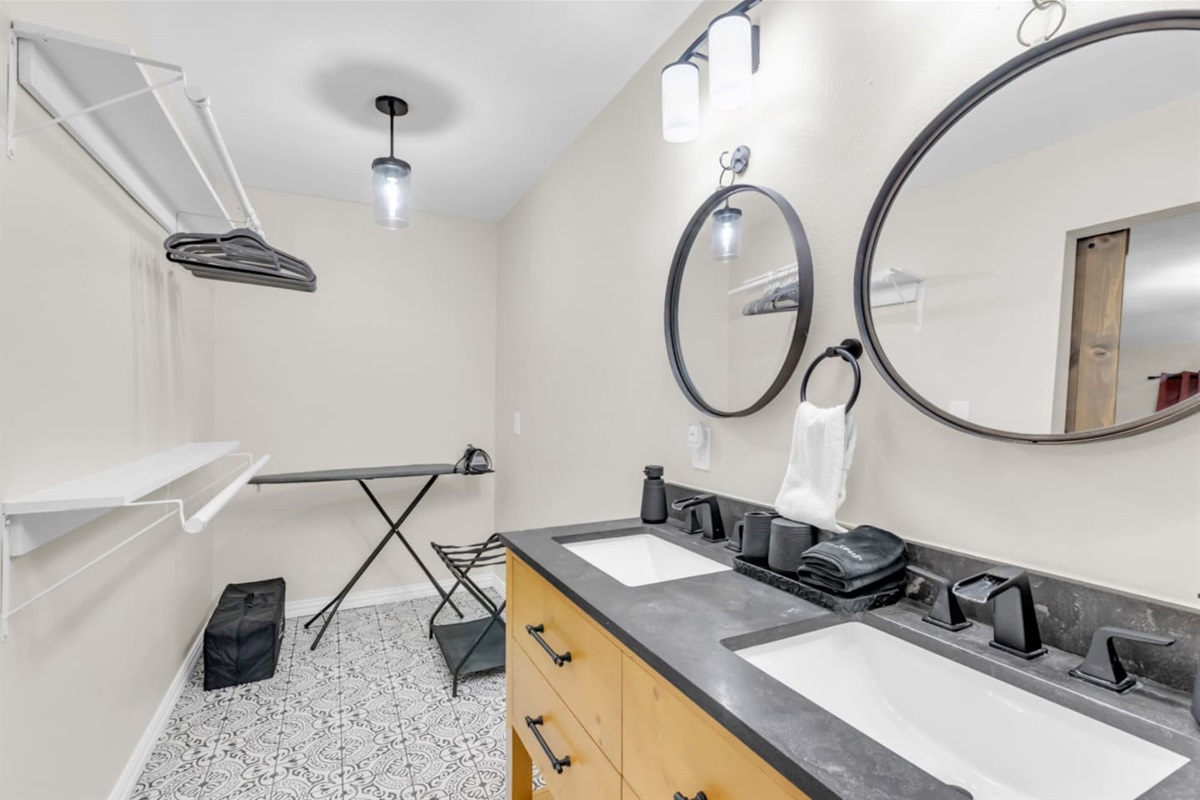 Spa inspired bathroom with dual vanities and bold modern finishes. 