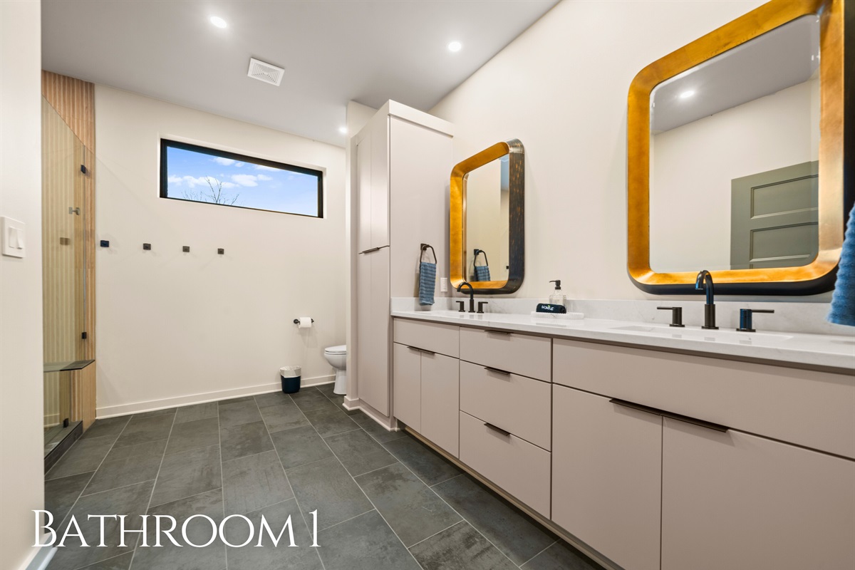 Getting ready is easy in this bright bathroom, with a spacious vanity, modern finishes, and a fresh, clean look that feels both practical and pretty.