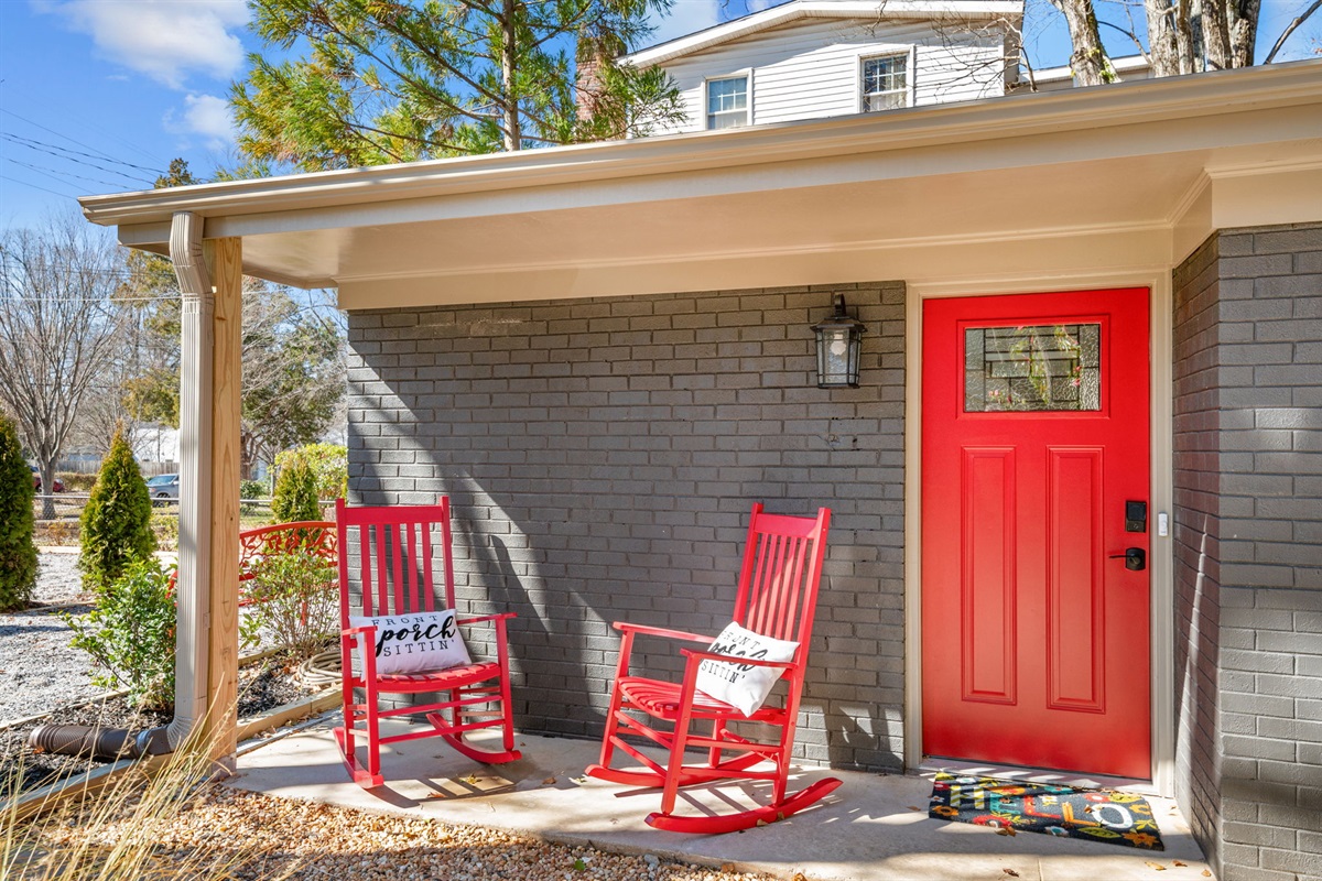 Relax in style with charming rocking chairs on the covered porch of this unit.