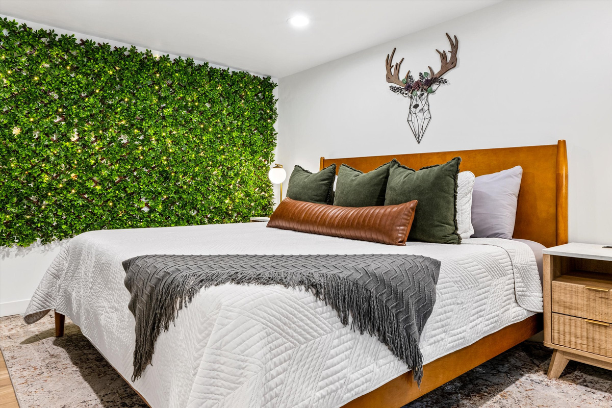 Master Bedroom with King Bed, 42-inch Smart TV, sound machine, blackout curtains and desk with computer monitor.   Full size washer/dryer with detergent provided.