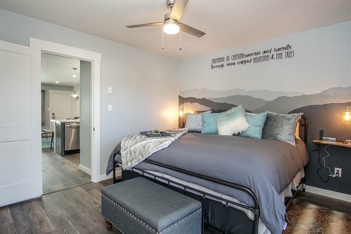 Spacious king bedroom with cozy bedding and peaceful mountain-inspired décor.