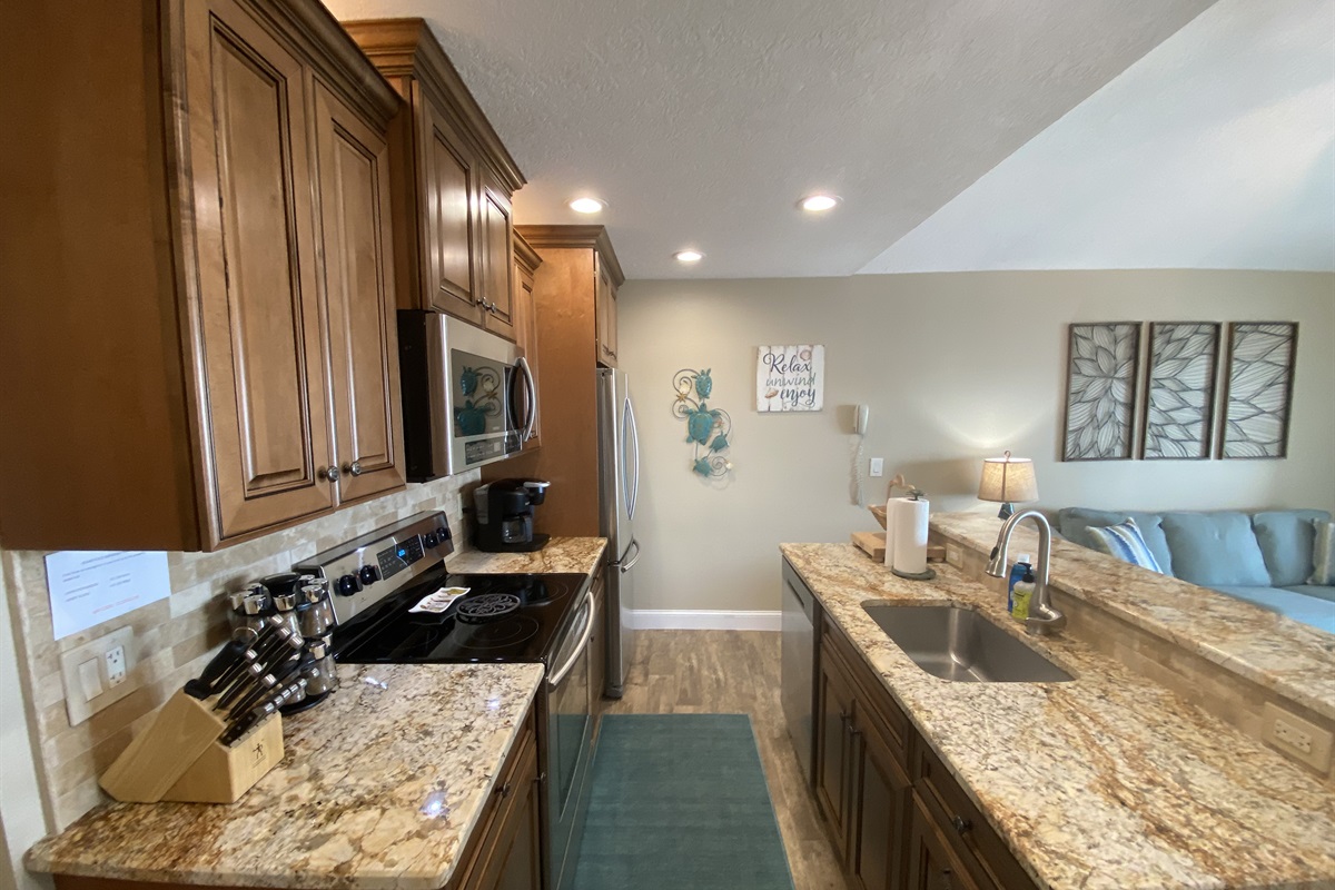 Beautifully decorated kitchen with granite countertops.