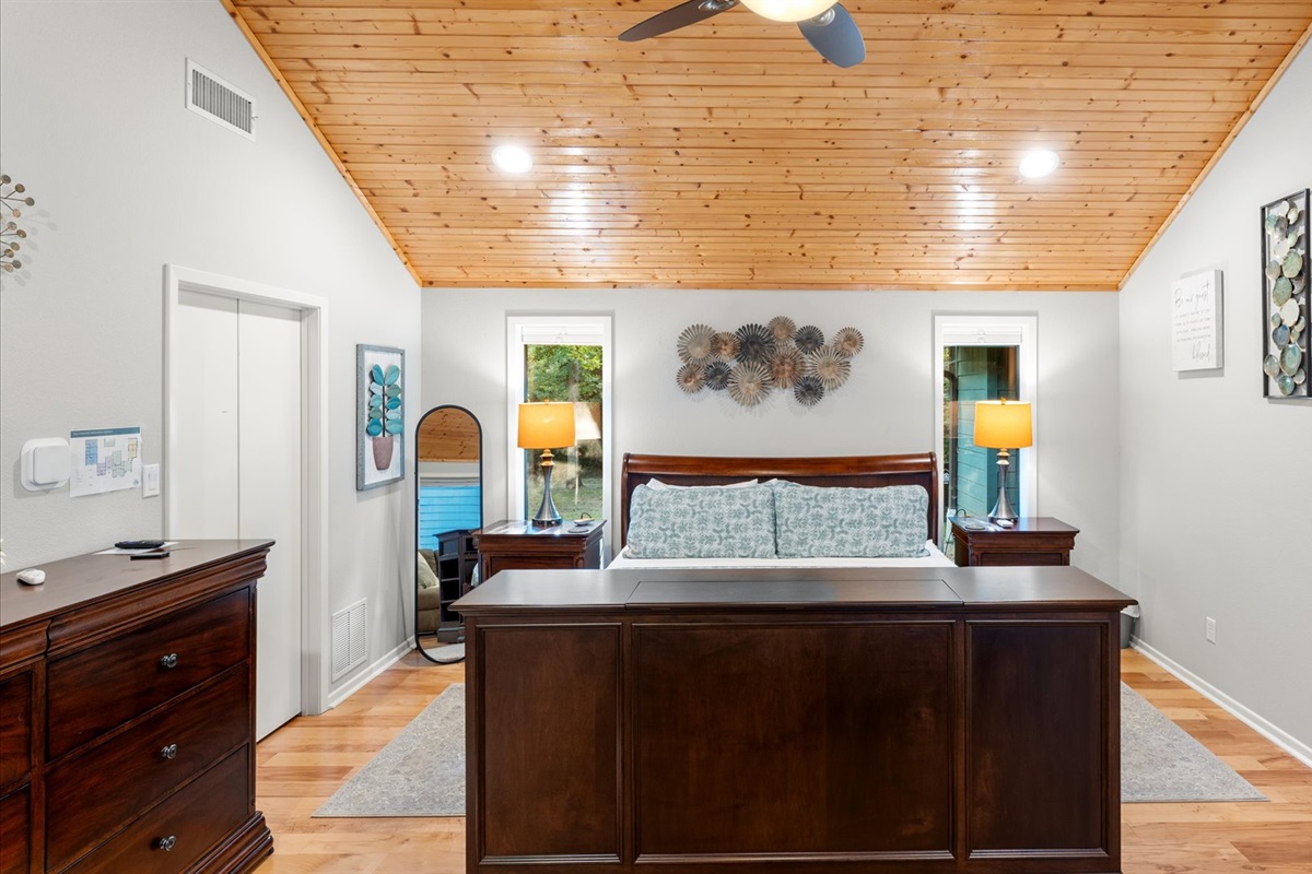 King 1 Bedroom offers a split king adjustable bed with a 40" TV in the footboard, charger lamps, extra outlets, a large dresser, 2 luggage racks, hangers, adult robes, and a reclining loveseat