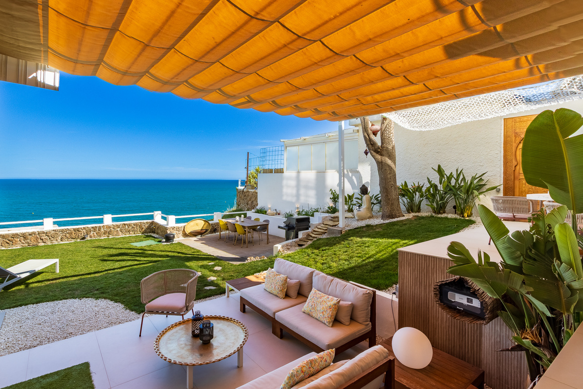 Covered terrace lounge with uninterrupted sea views
