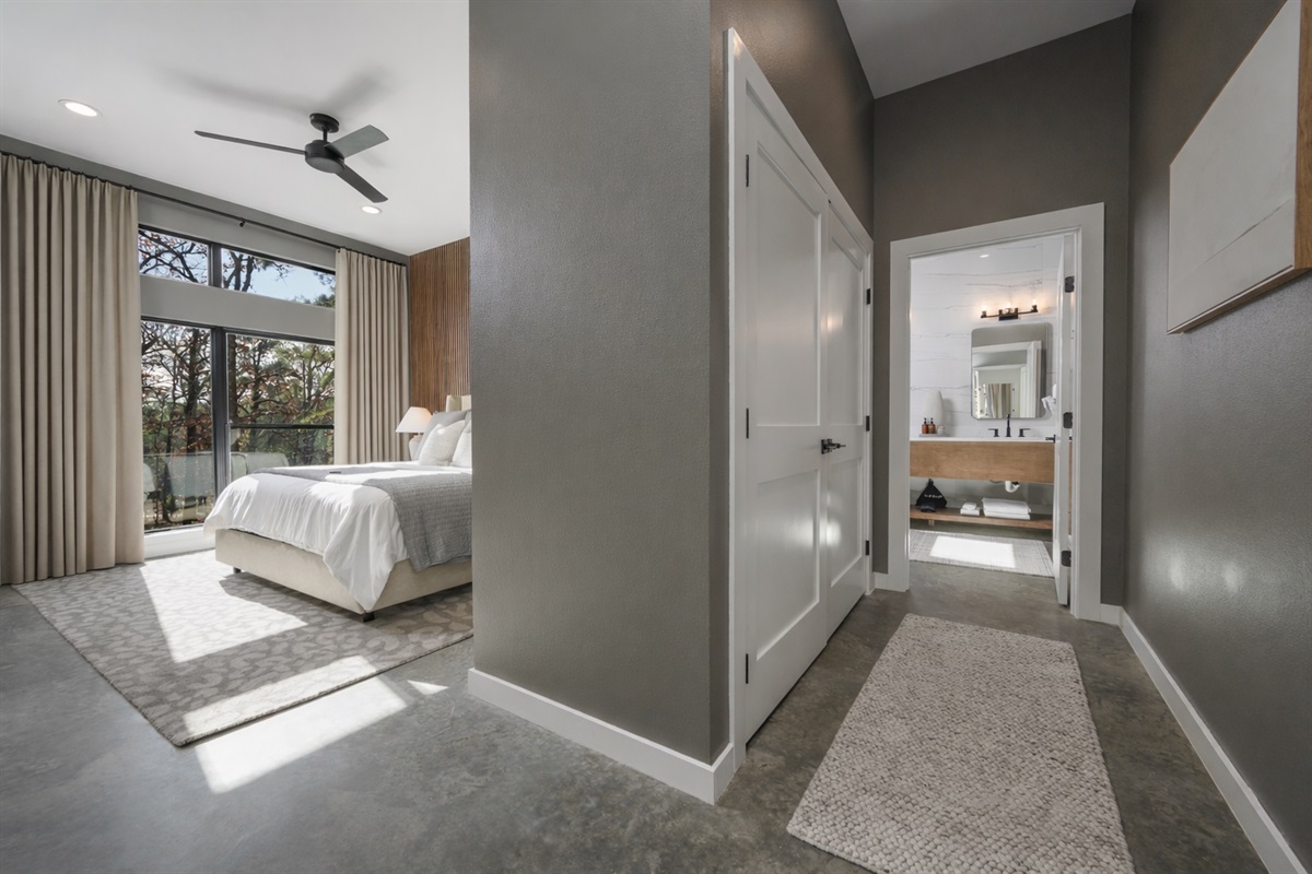 King Suite 1 - Large and spacious suite with teak wood paneling, smart TV, premium king mattress, and luxury bedding. Includes stunning views of the hardwood forest. 