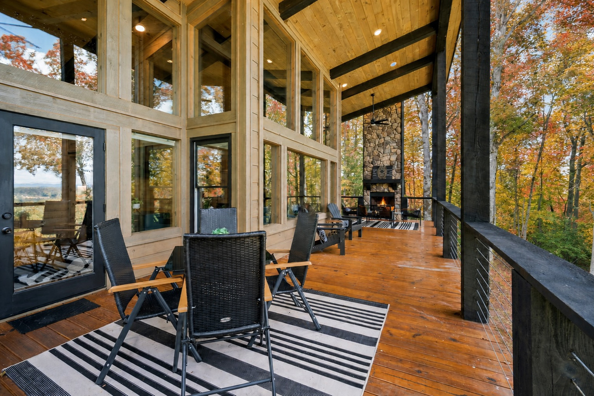The expansive deck provides plenty of outdoor living space, with comfortable seating and panoramic views.