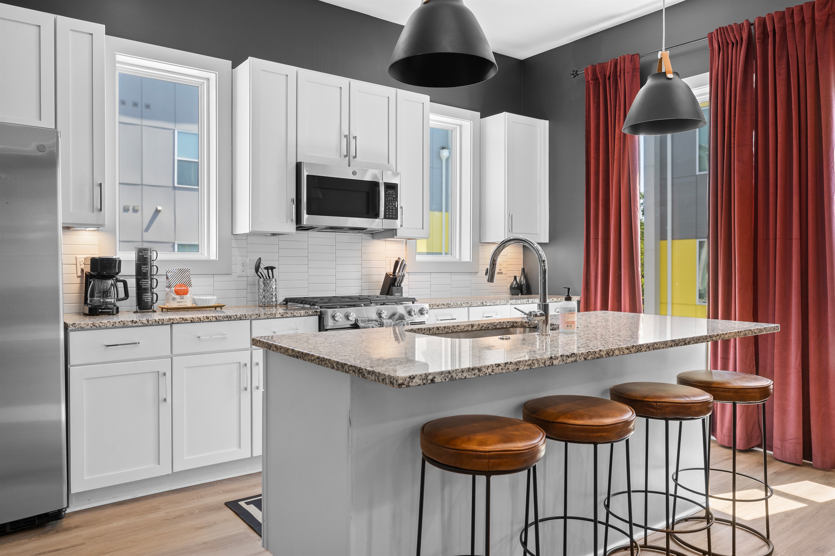 Kitchen: Stylish space with granite countertops, modern appliances, and vibrant views!