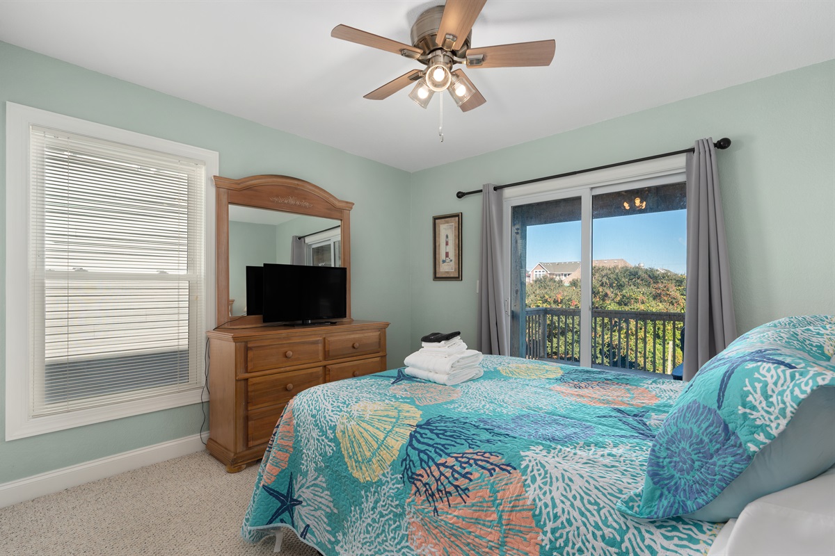 Comfortable Queen bedroom with Smart TV and private deck access.