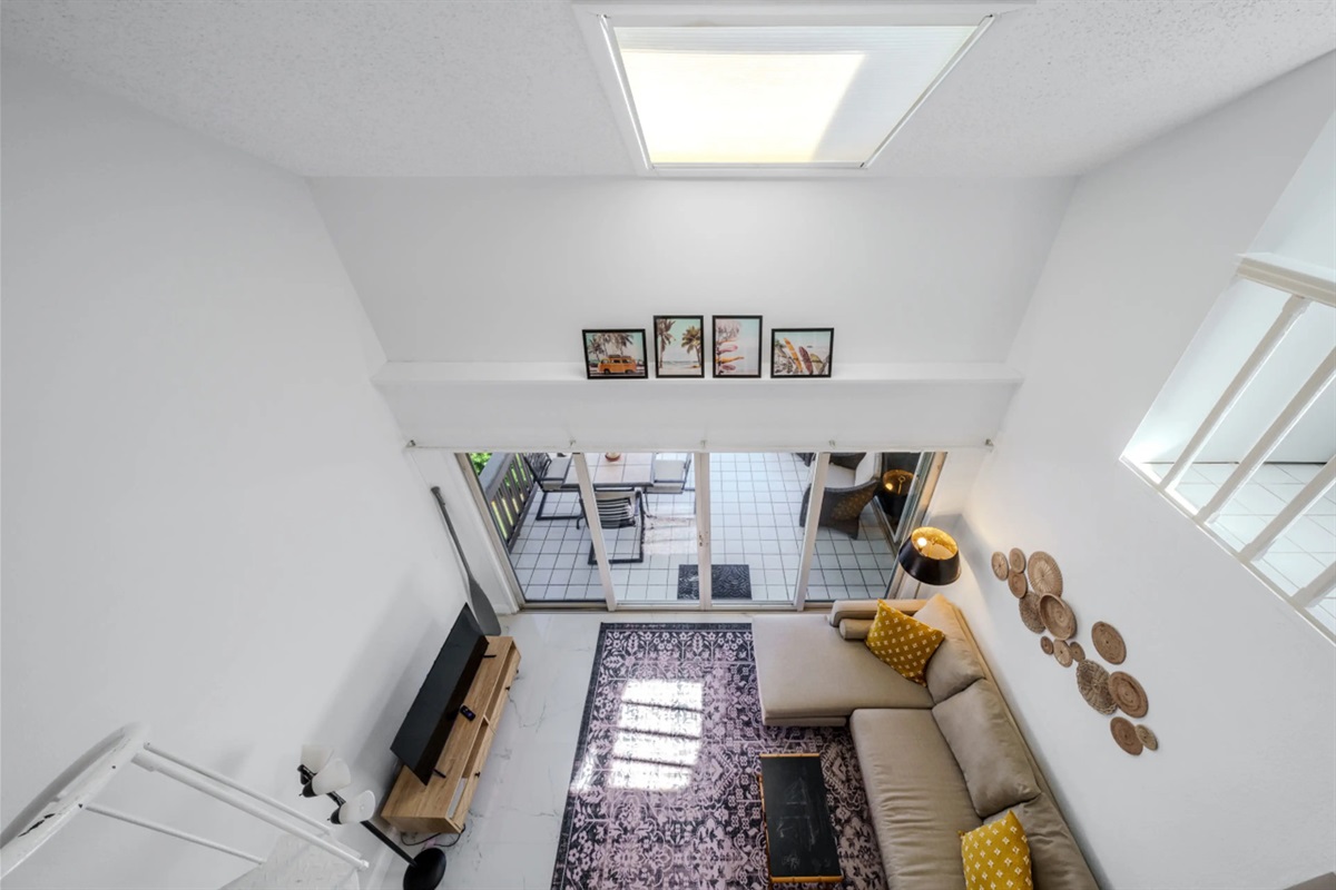 Stunning overhead view showcasing the open-concept living space and dramatic vaulted ceilings.