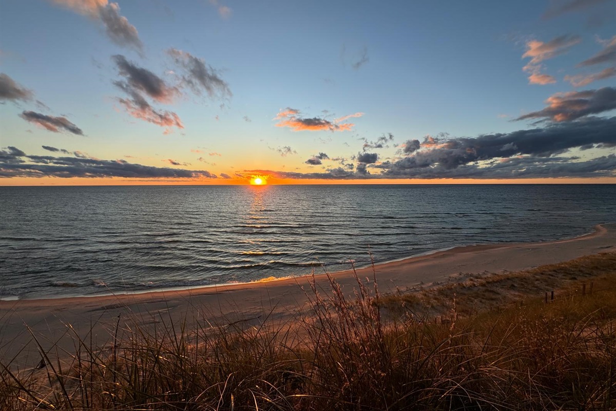 Relax along 372 ft of Lake Michigan beachfront and soak in the beautiful sunsets