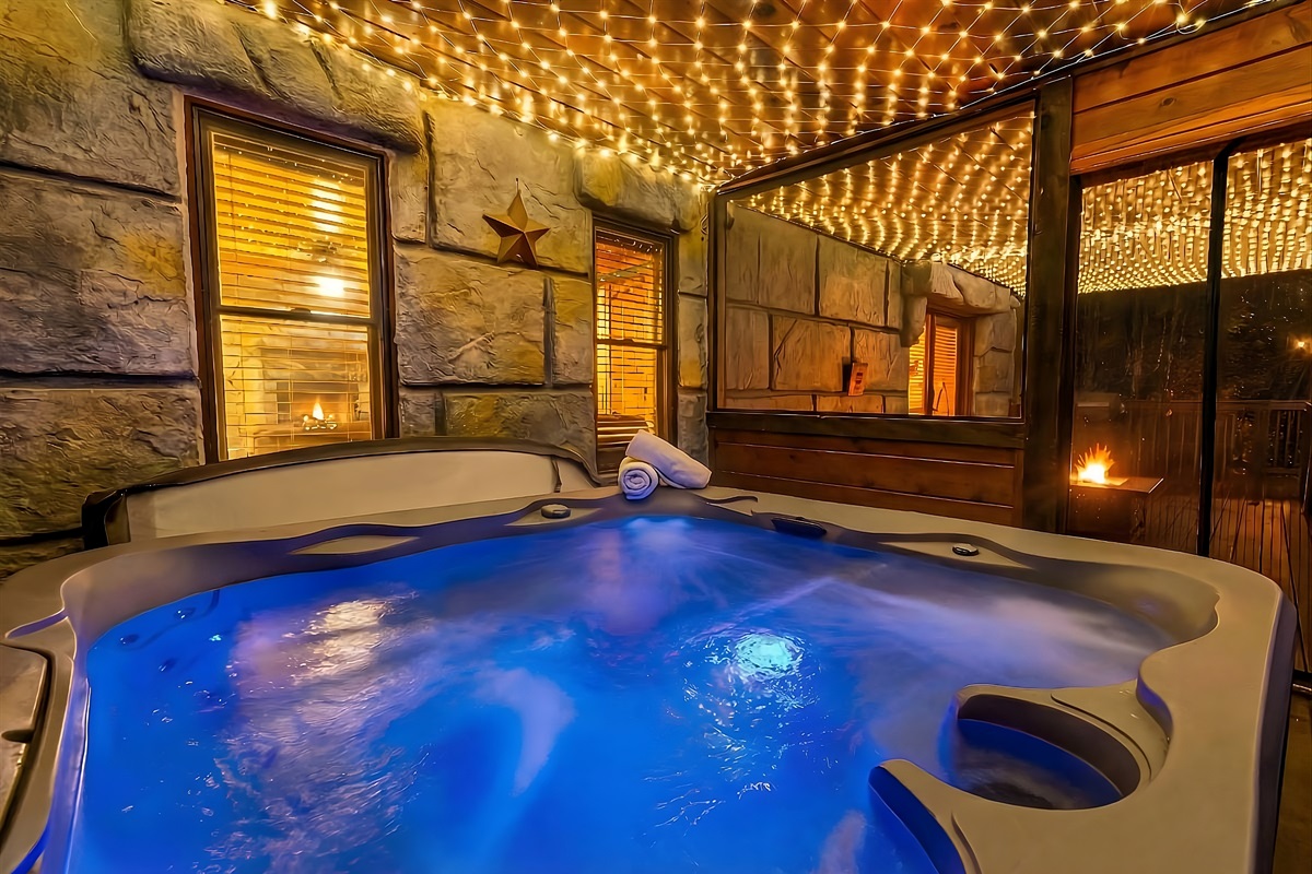 Private enclosed hot tub with screened windows. A perfect mixture of warm water, a light breeze, and the twinkle of lights