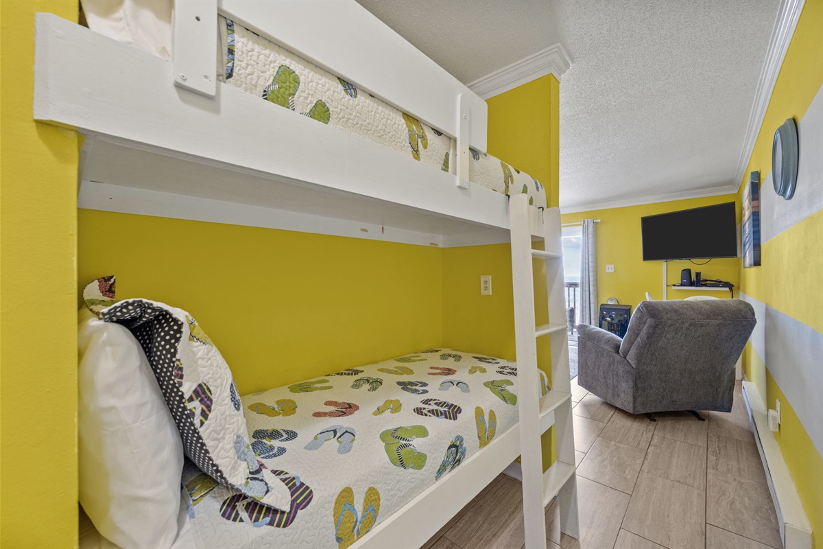 Hallway bunk beds create a cozy sleeping space while keeping the main living area open