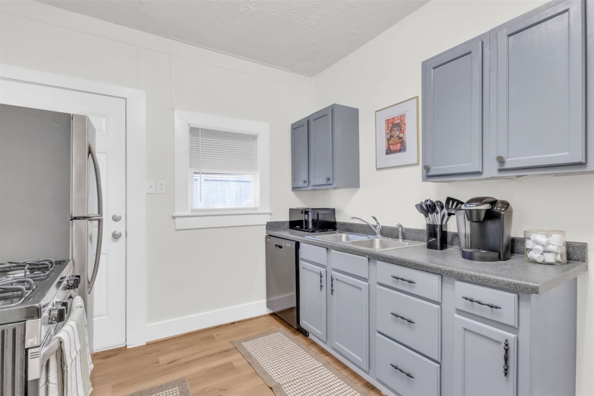 Spacious kitchen with modern appliances.