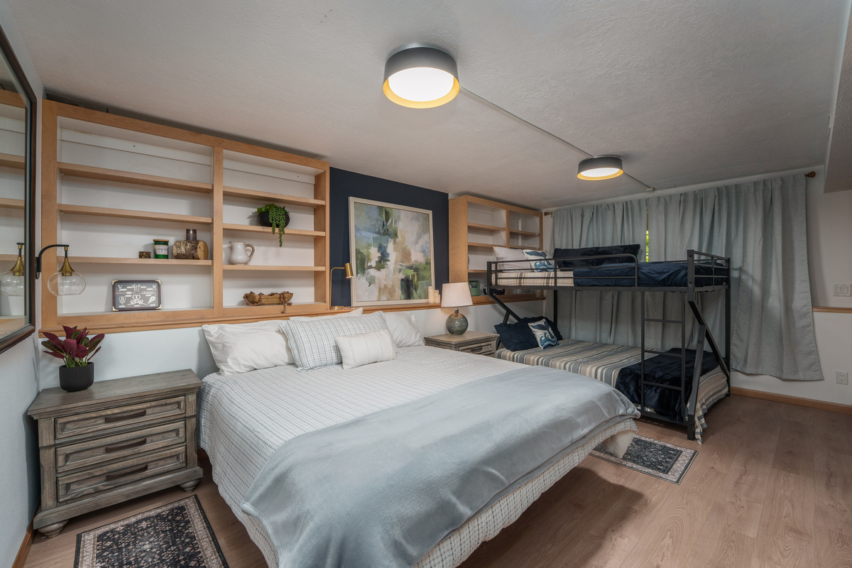 1 Queen bed, 1 Queen-on-Queen bunk. Sleeps 6. Remote work desk setup.