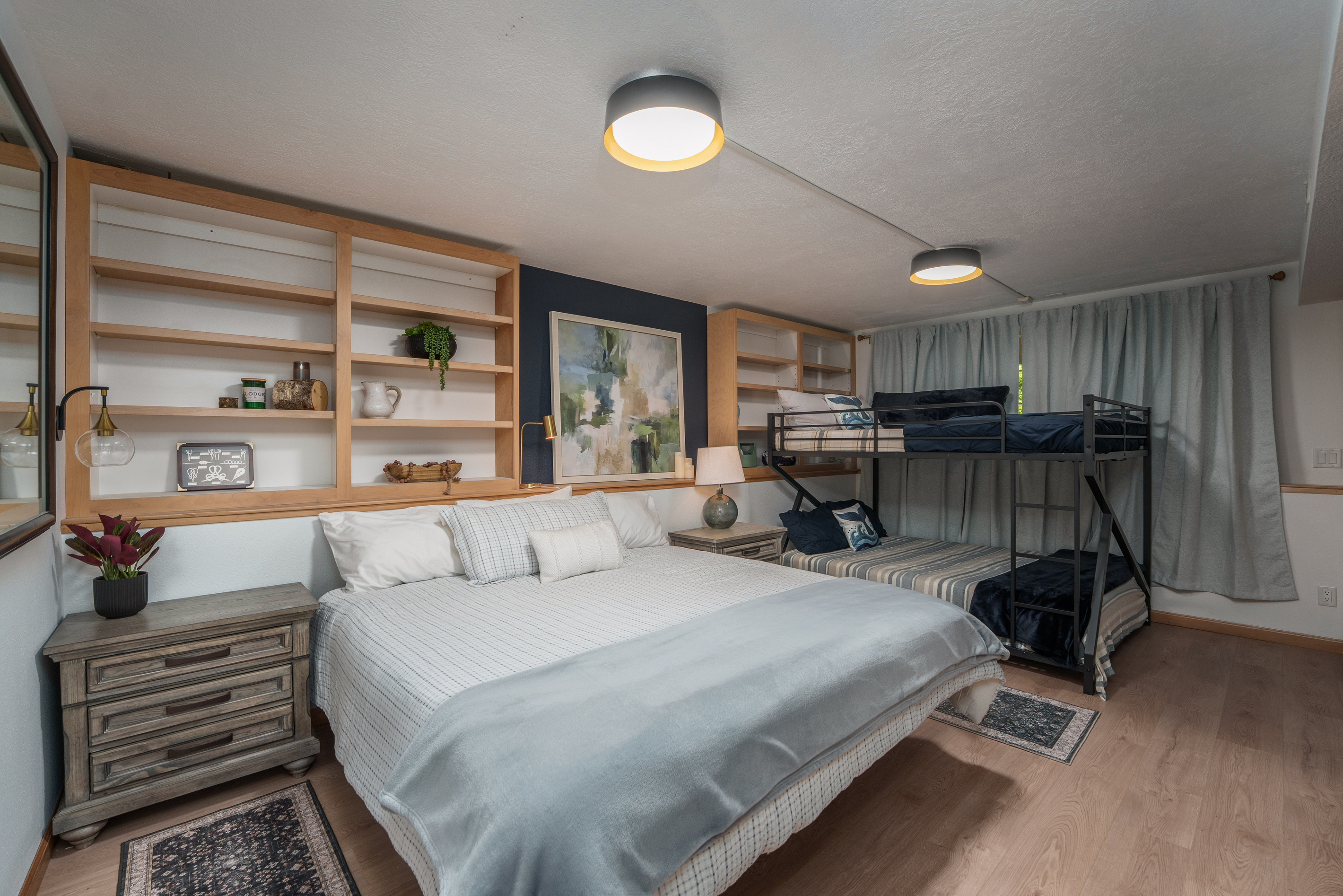 1 Queen bed, 1 Queen-on-Queen bunk. Sleeps 6. Remote work desk setup.
