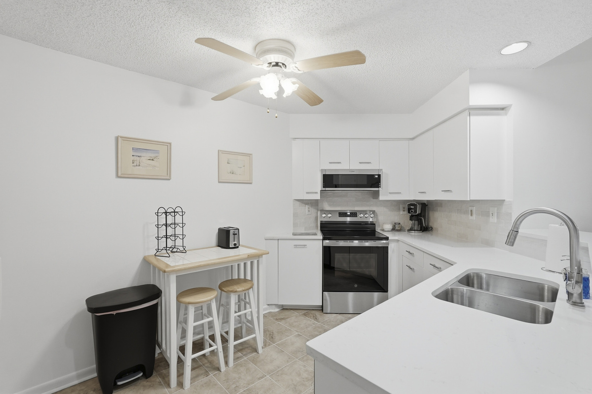 Fully equipped with modern appliances and essential cookware, the kitchen makes preparing meals easy, whether you're brewing your morning coffee or cooking a delicious meal for the group.