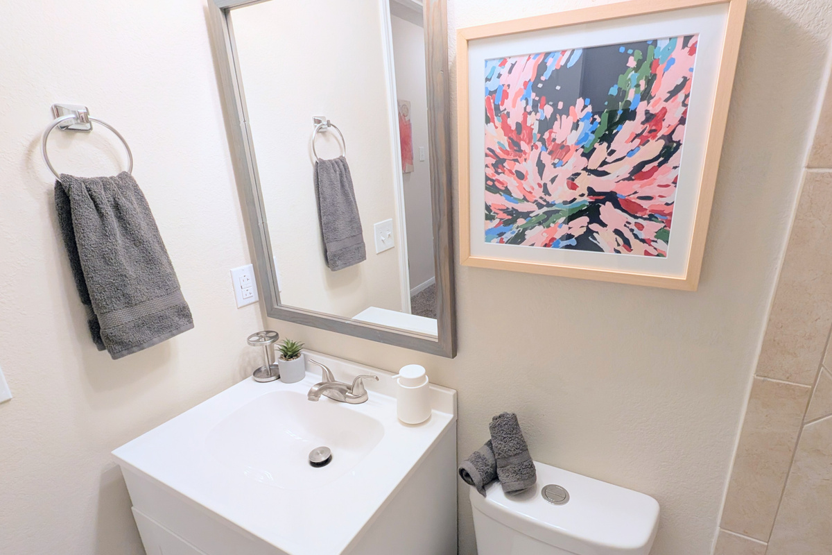 Full bath has foaming hand soap, hair dryer, extra toilet paper, and step stools. 