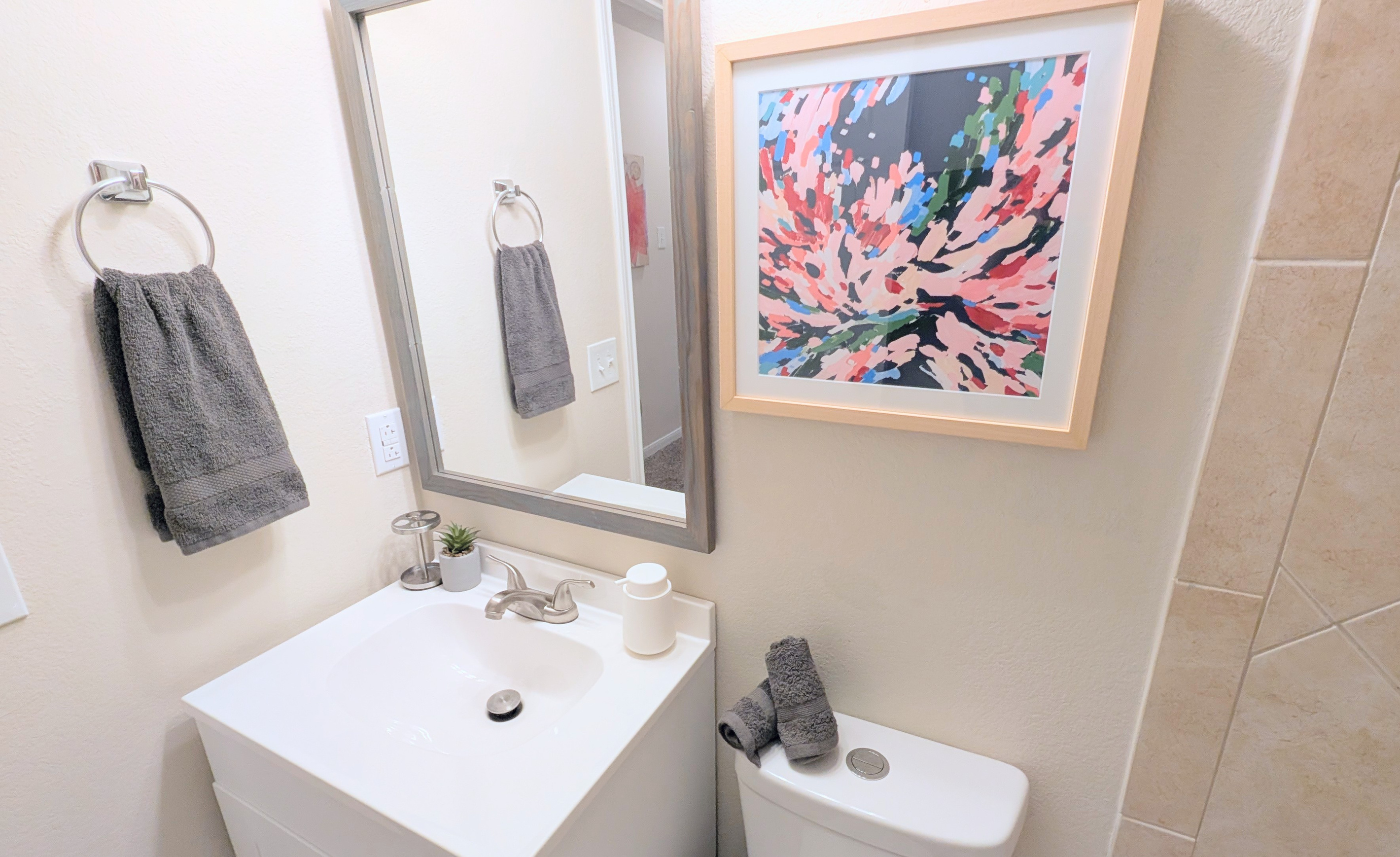 Full bath has foaming hand soap, hair dryer, extra toilet paper, and step stools. 