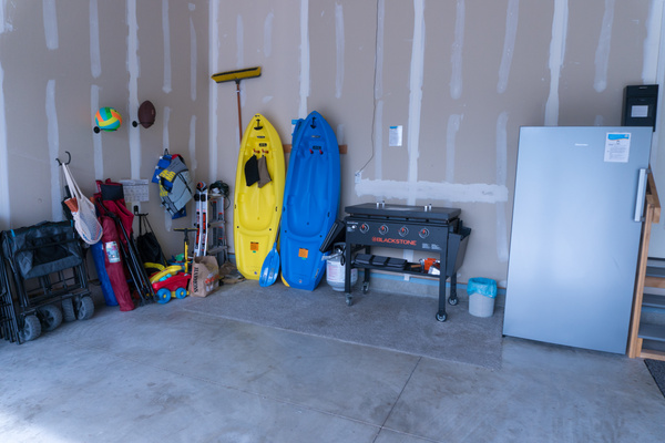 Garage includes: 2nd refrigerator, Blackstone grill, 2 youth kayaks, wagon, camp chairs, pickleball raquets & balls, and sand toys