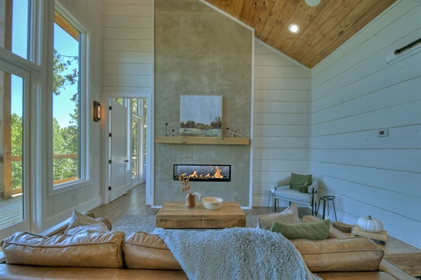 The gas 42" dual sided fireplace warms the living area