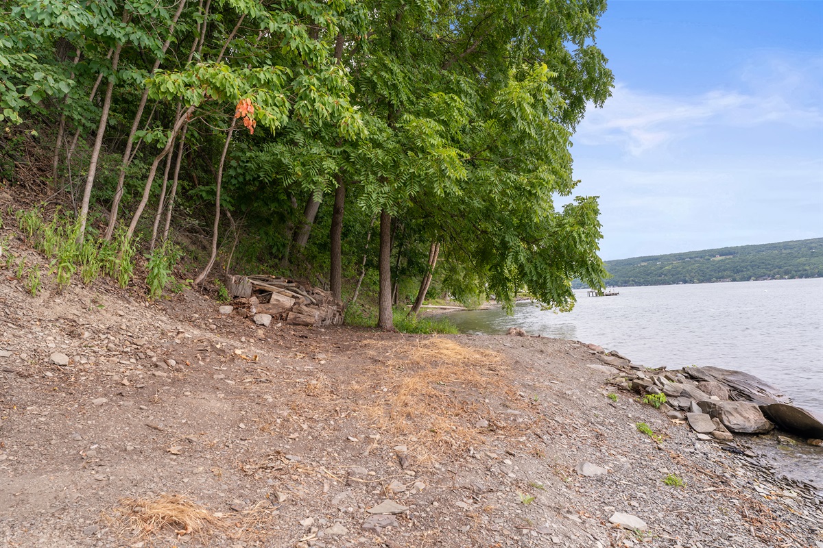 Enjoy peaceful lakefront views along the shaded shoreline, ideal for walks and waterfront relaxation.