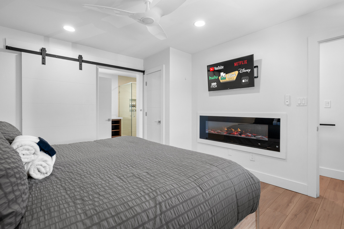 Spacious primary bedroom retreat designed for comfort and relaxation.