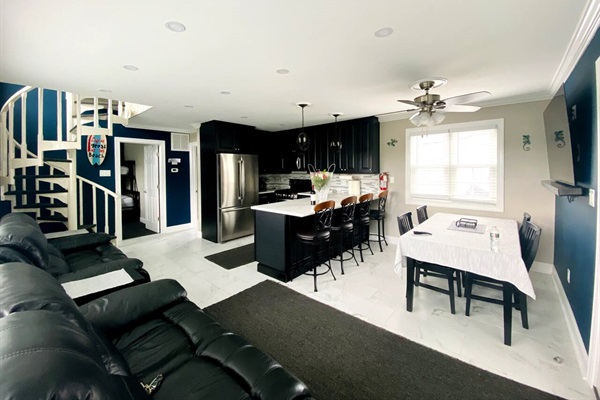 Living room, kitchen and dining area.Brand new flat screen tv.